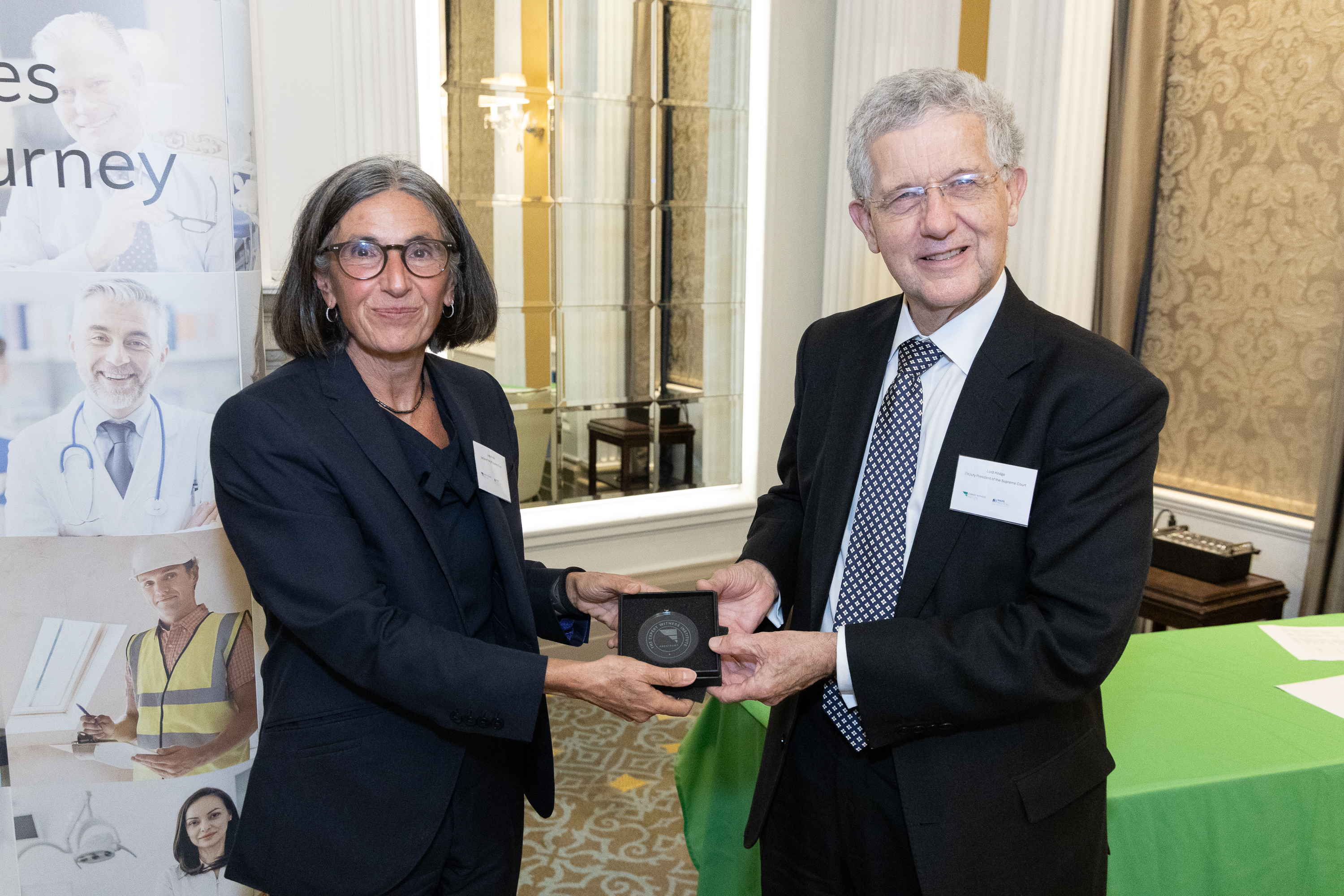 Lord Hodge presents Lady Simler with the Presidential Medal